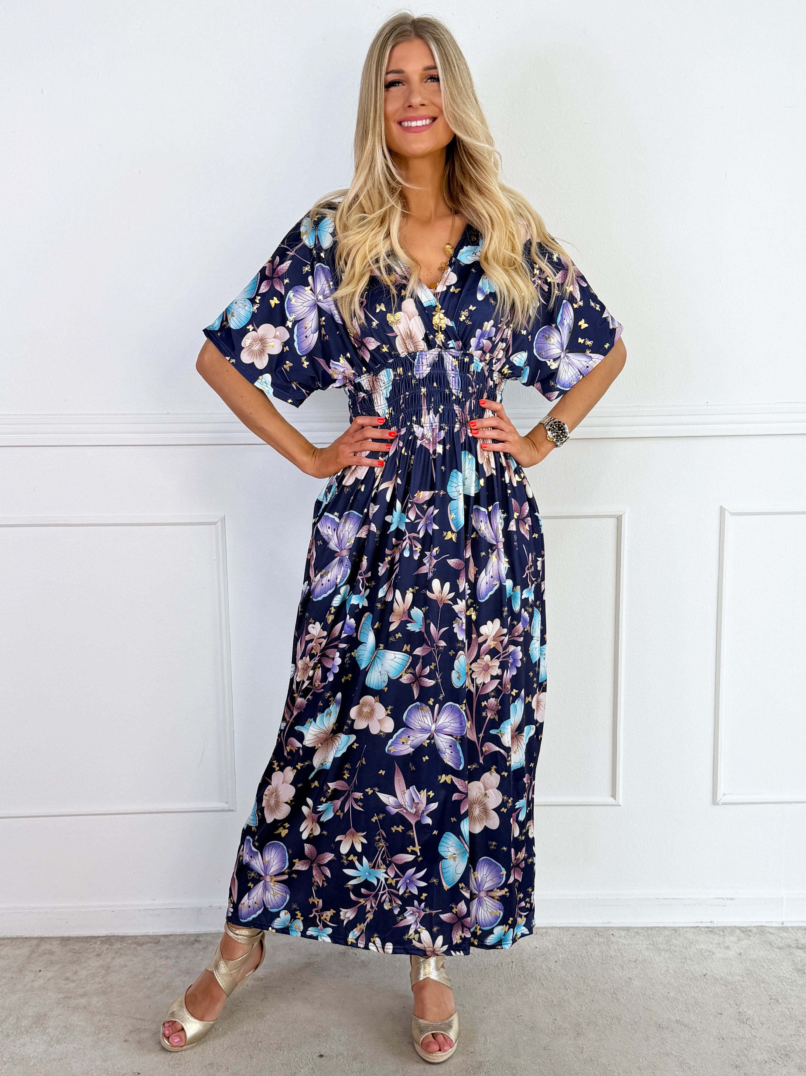 Pams Fairytale - Lang elastisk kjole i fint blomster- og sommerfugleprint